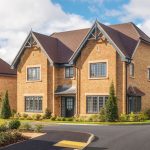 Modern brick house with landscaped garden.