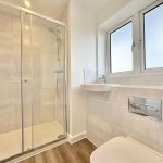 Modern bathroom with shower and large window