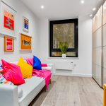 Colourful living room with art and modern decor.