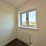 Empty room with window and radiator