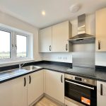 Modern kitchen with built-in oven and sink