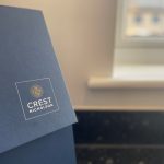 Crest Nicholson folder near a window