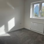 Empty room with window and radiator