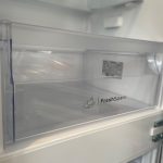 Open fridge freezer with FreshSpace compartment.