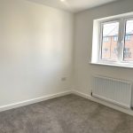 Empty room with window and radiator