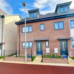 Modern terraced houses with red brick exteriors