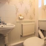 Small bathroom with sink and toilet