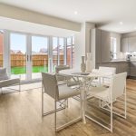 Modern kitchen and dining area with garden view.