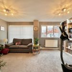 Modern living room with sofa and exercise bike