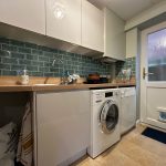 Modern utility room with washing machine