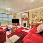 Cosy living room with modern furnishings and decor.