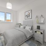 Bright grey bedroom with teddy bear and artwork.