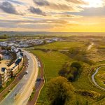 Aerial view of countryside at sunset.