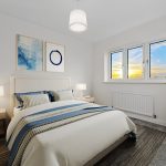 Bright modern bedroom with sunset view.