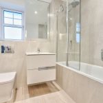 Modern bathroom with shower and sleek design.