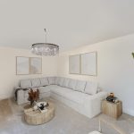Modern living room with grey sofa and chandelier.