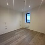 Empty room with wooden floor and window