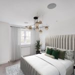 Modern bedroom with stylish decor and lighting.