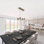 Modern open-plan kitchen dining area with natural light.