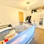 Cosy children's bedroom with toys and decorations.