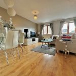 Modern living room with dining area and large windows