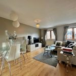 Modern living room with dining area and sofa