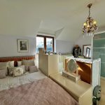 Cosy bedroom with stylish decor and chandelier