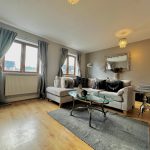 Modern living room with neutral decor.