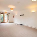 Spacious living room with natural light.