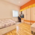 Modern bedroom with wardrobe and desk