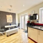 Modern kitchen with dining area and natural light