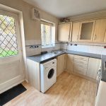 Modern kitchen with wooden cabinets and appliances