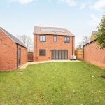 New brick house with grassy garden