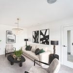 Modern living room with abstract art and chandelier