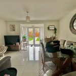 Modern living room with glass dining table.
