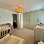 Cosy nursery with cot and changing table