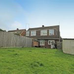 Back garden view of a detached house