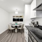 Modern kitchen and dining area with artwork