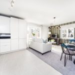 Modern open-plan kitchen and living room interior design.