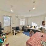 Bright living room with toys and furniture.