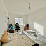 Bright bedroom with desk and chair