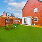 Brick house with garden and swingset