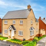 Modern brick house on residential street.