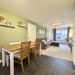 Modern living room with dining table and sofa.