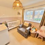 Cosy nursery with crib and toys.