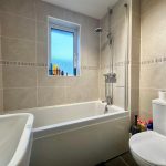 Modern bathroom with bathtub and shower.