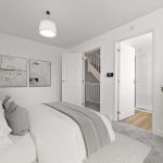 Modern bedroom with white decor and indoor plant.