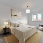 Modern bedroom with double bed and decor.