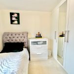 Modern bedroom with single bed and wardrobe