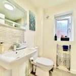 Modern bathroom with sink and large mirror